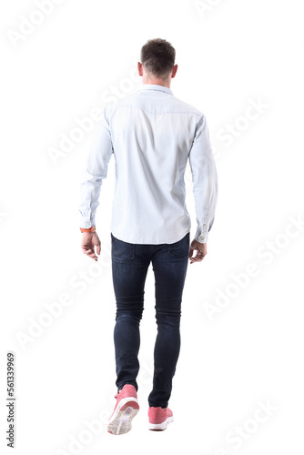 Back view of handsome elegant business man in sneakers walking away and looking ahead. Full body isolated on transparent background.