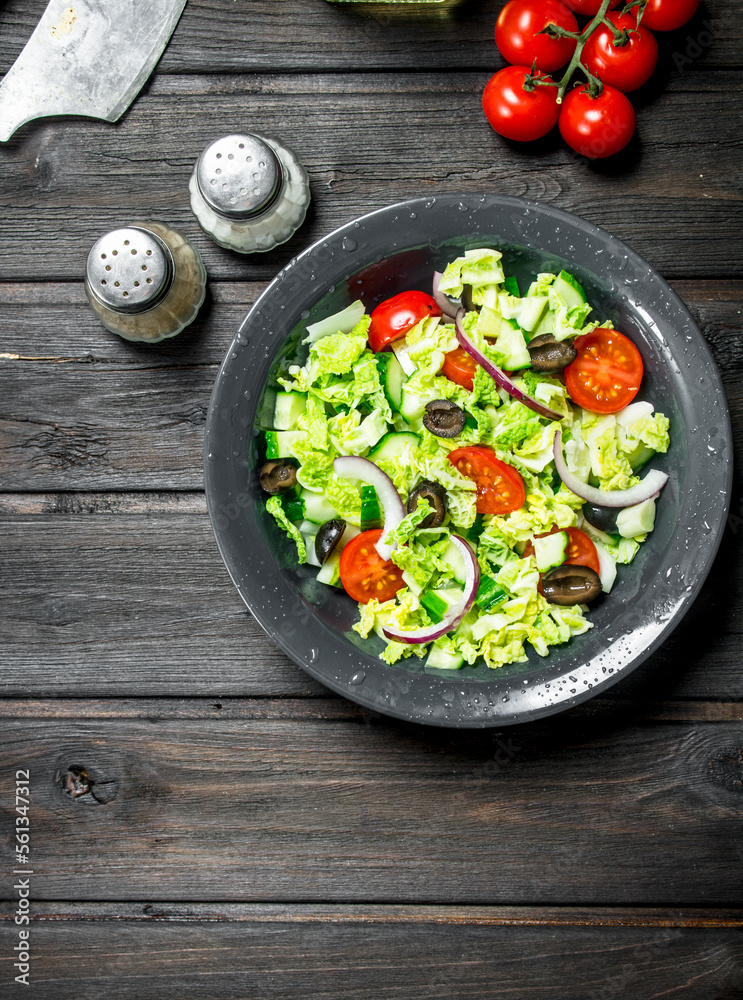 Vegetable salad. Salad of cucumbers, tomatoes and red onions with spices and olive oil.