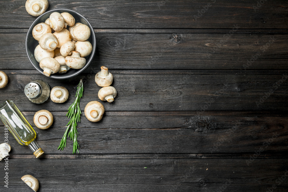 Fragrant mushrooms in a bowl with pepper and oil. Fragrant mushrooms in a bowl with pepper and oil.