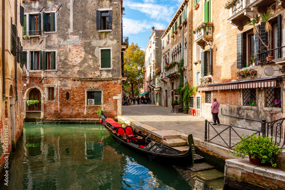 Gondola on Venice canal and medieval architecture, Italy