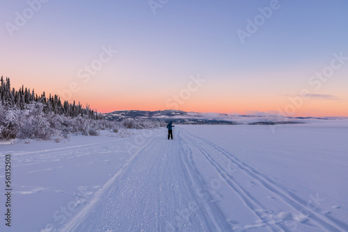 One person skiing on cross country ski trails during winter time at sunset.  © Scalia Media
