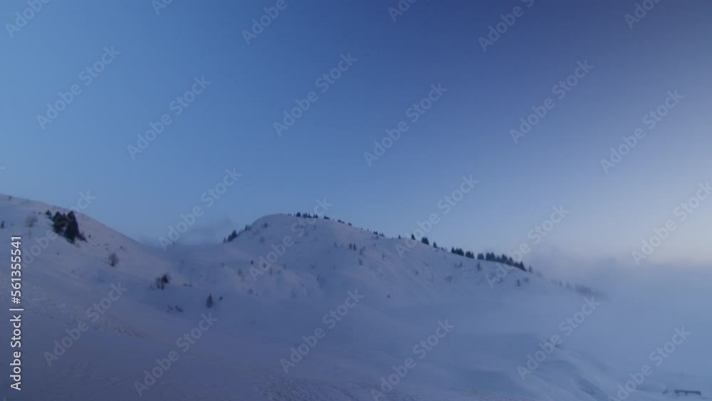 Snowy mountains at dusk in the Swiss Alps Snowy mountains at dusk in the Swiss Alps