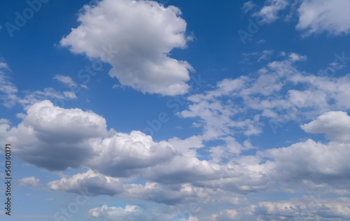 Summer evening sky in the picturesque clouds, lit by the rays of the setting sun. © Anatoliy