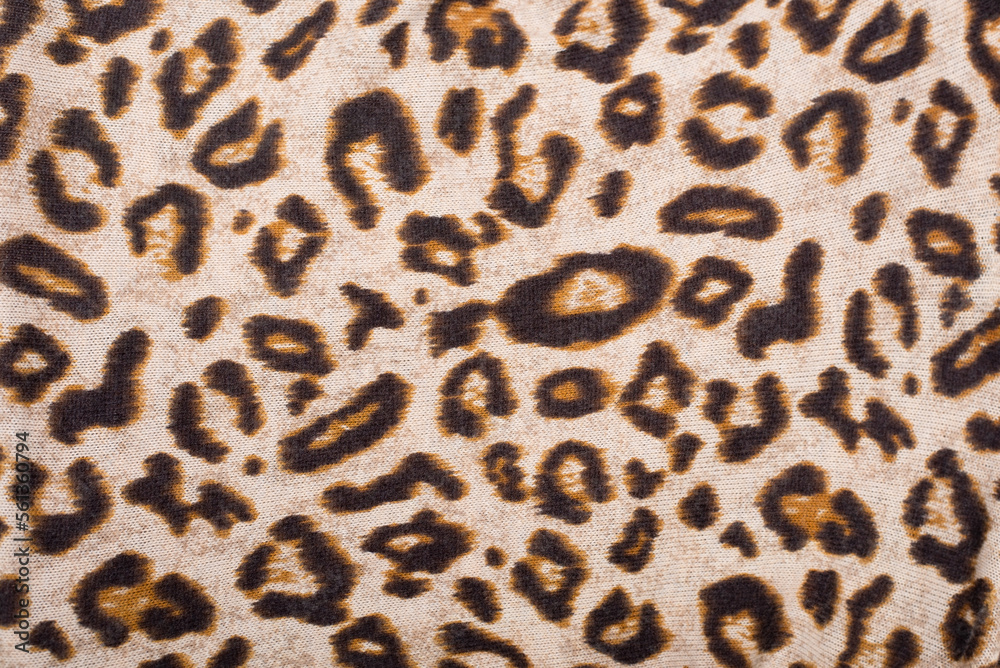 Fabric with an applied image of the skin of a wild animal cheetah or leopard, close-up. Leopard skin imitation, close up Fabric with an applied image of the skin of a wild animal cheetah or leopard, close-up. Leopard skin imitation, close up