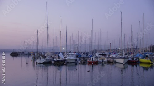 A small marina with boats at sunrise on Lake Geneva, Switzerland