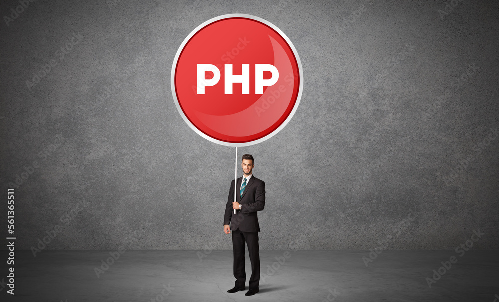 Fototapeta premium Young business person holdig traffic sign