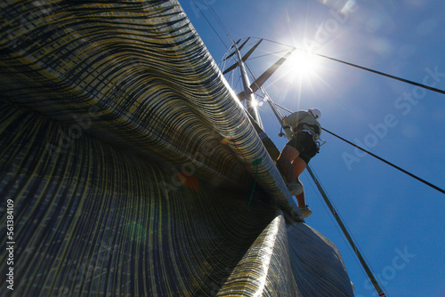 One man climbing the rig on board Alfa Romeo during a test sail in Sydney, Australia in preparation for the Rolex Sydney to Hobart 2009. photo