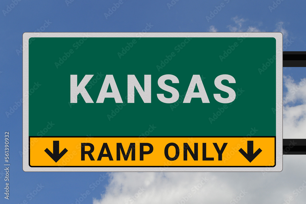Kansas logo.  Kansas lettering on a road sign. Signpost at entrance to  Kansas, USA. Green pointer in American style. Road sign in the United States of America. Sky in background