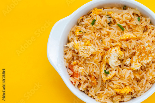 Fried rice on yellow background.
