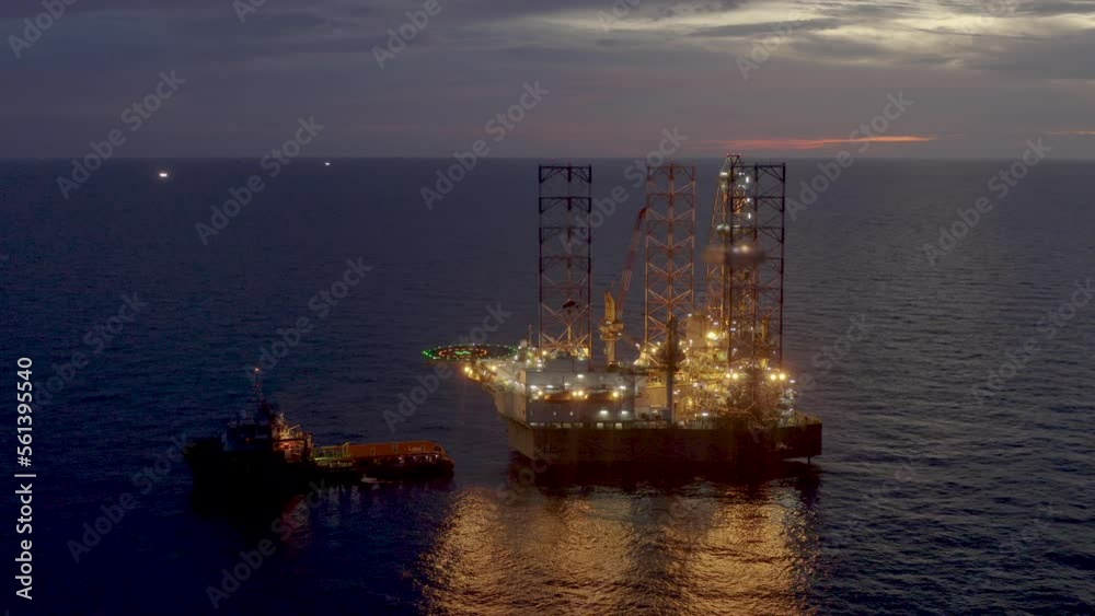 Aerial view of jack up drilling rig in the middle of the ocean while rig move at night time
Aerial view of jack up drilling rig in the middle of the ocean while rig move at night time