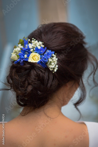 portrait of a woman hair bun flowers clipped hairpiece