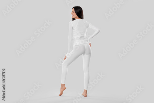 Woman in warm thermal underwear on white background, back view