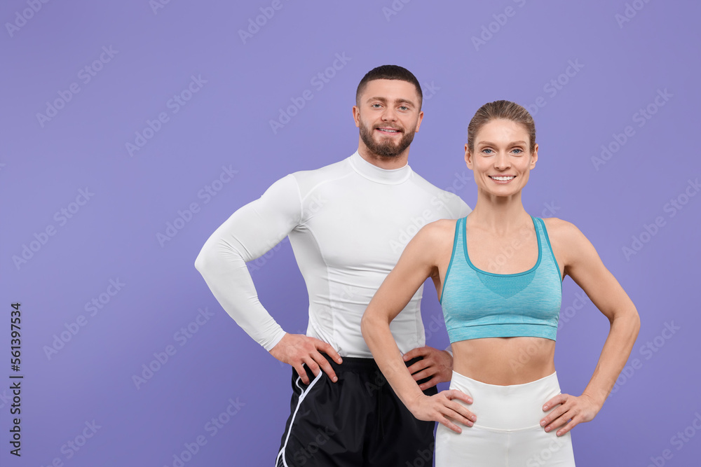 Portrait of happy athletic people on purple background, space for text Portrait of happy athletic people on purple background, space for text