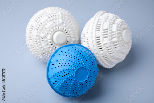 Dryer balls for washing machine on light grey background, closeup