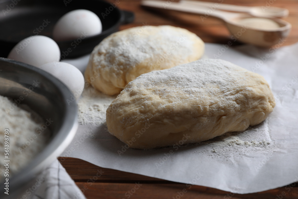 Raw dough, eggs and flour on wooden table. Cooking ciabatta Raw dough, eggs and flour on wooden table. Cooking ciabatta