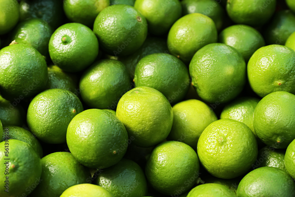 Fresh ripe green limes as background, closeup Fresh ripe green limes as background, closeup