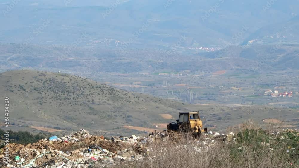 City Dump. The Bulldozer Compacts the Garbage on the Landfill. Wastes of Human Life City Dump. The Bulldozer Compacts the Garbage on the Landfill. Wastes of Human Life