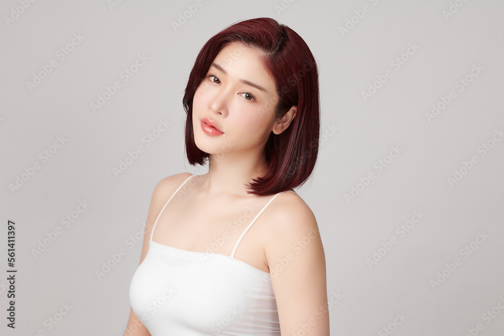 Beautiful young asian woman with clean fresh skin on grey background, Face care, Facial treatment, Cosmetology, beauty and spa, Asian women portrait. Beautiful young asian woman with clean fresh skin on grey background, Face care, Facial treatment, Cosmetology, beauty and spa, Asian women portrait.