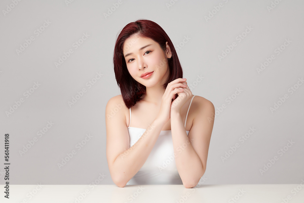 Beautiful young asian woman with clean fresh skin on grey background, Face care, Facial treatment, Cosmetology, beauty and spa, Asian women portrait. Beautiful young asian woman with clean fresh skin on grey background, Face care, Facial treatment, Cosmetology, beauty and spa, Asian women portrait.
