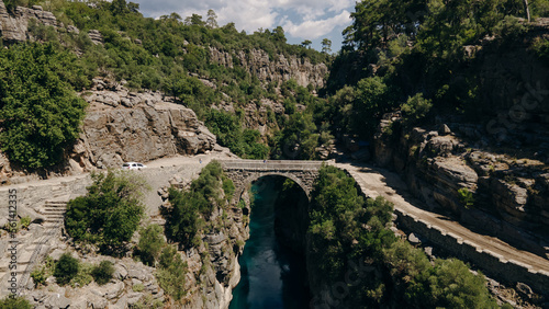 Ancient arch bridge over the Koprucay river gorge in Koprulu national Park in Turkey.