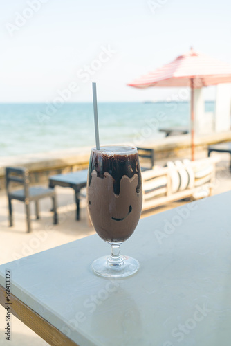Fototapeta Naklejka Na Ścianę i Meble -  ice chocolate milkshake with sea background