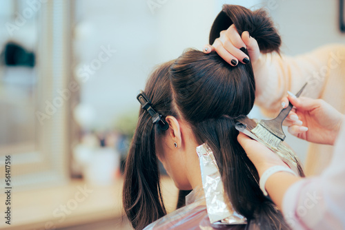 Bild auf Leinwand Hairdresser Sectioning and Dying the Hair of a Client