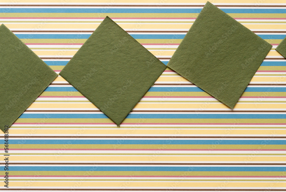 Obraz premium moss green paper tiles or squares on scrapbook paper with stripes
