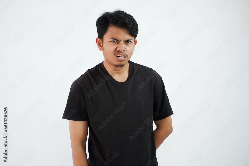 annoyed young Asian man wearing black t shirt stand doubt face feels dizzy isolated on white background annoyed young Asian man wearing black t shirt stand doubt face feels dizzy isolated on white background