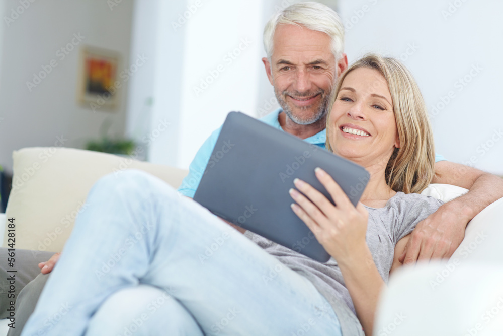 Mature couple, tablet or relax on sofa in house or home living room on social media or internet app. Happy smile, retirement man or woman on digital technology for video call, movie streaming or news