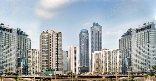 Modern building and business office and tower cityscape of Bangkok Thailand with highway road