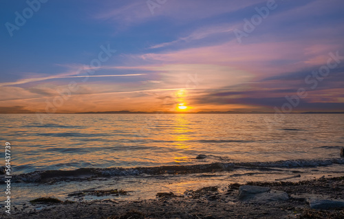 Sunrise over the sea and beautiful cloudscape. Colorful ocean beach sunrise with deep blue sky and sunrays Sunset, beach