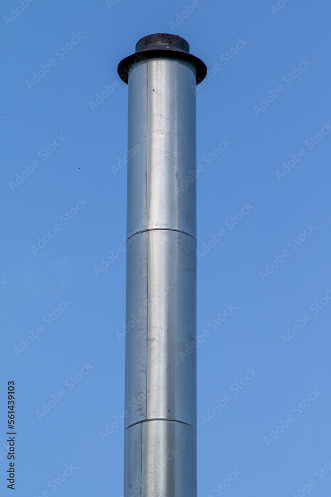 Metal pipes on the roof against the sky. Metal pipes on the roof against the sky.