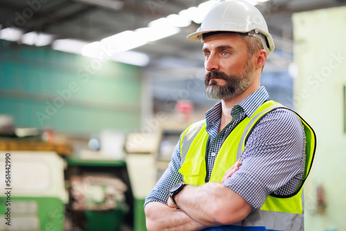 Portrait Caucasian professional Engineer factory. Engineering worker in safety hardhat at factory industrial facilities. Heavy Industry Manufacturing Factory