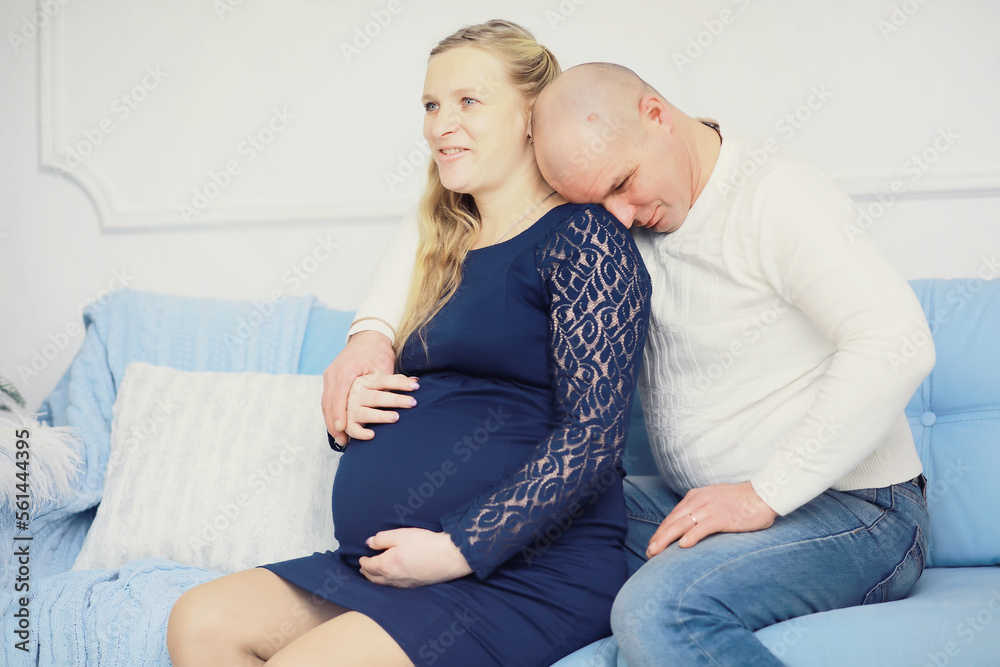 Husband and wife are expecting children. Young family couple pregnancy. A woman with a big belly. Husband and wife are expecting children. Young family couple pregnancy. A woman with a big belly.