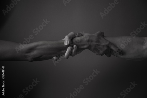 two hands holding each other