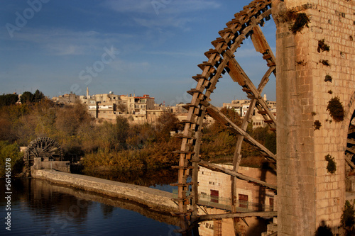 The ancient Syrian wooden Noria water wheels on the river Orontes, Hama, Syria,  photo