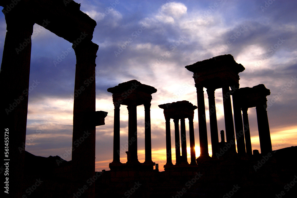 Dramatic sunset sky behind the Roman Tetrapylon columns of Palmyra, Syria..