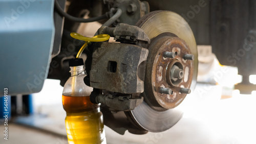 Automatic change of brake fluid in a car service. 