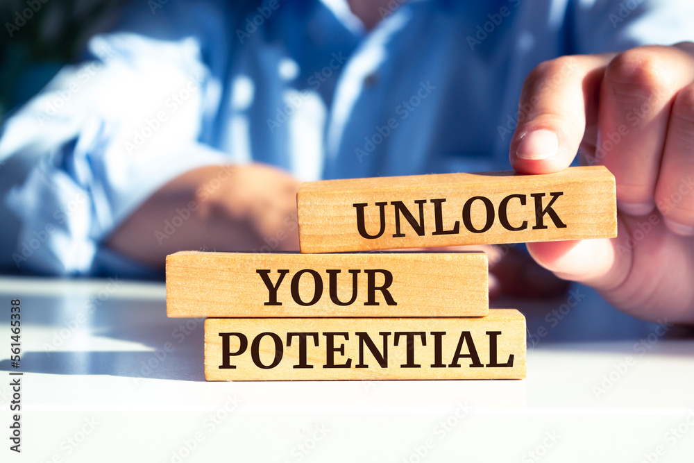 Closeup on businessman holding a wooden block with Closeup on businessman holding a wooden block with