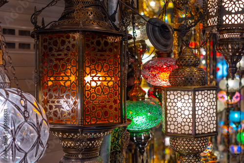 Shopping for colorful traditional Middle Eastern lamps for sale in an Istanbul Bazaar, Turkey.