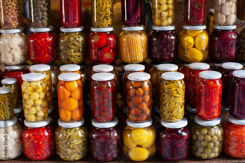 Brightly colored jars of Turkish Turşu, pickled vegetables for sale in an Istanbul Bazar, Turkey.