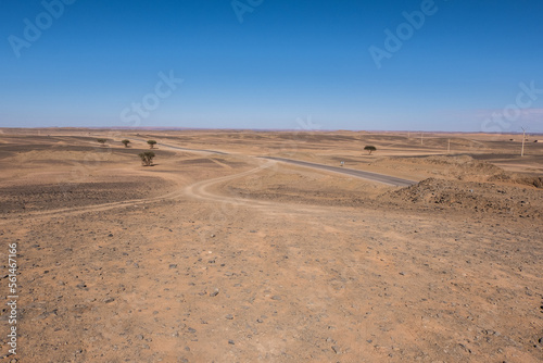 A winding road through the vast Sahara desert of Morocco