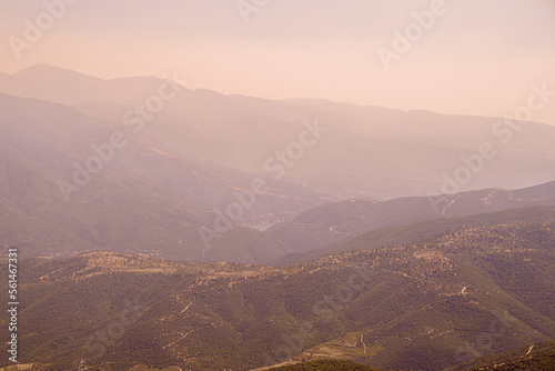 Panoramic view of top of mountains in sunny summer weather in Greece at sunset. Aerial view photo