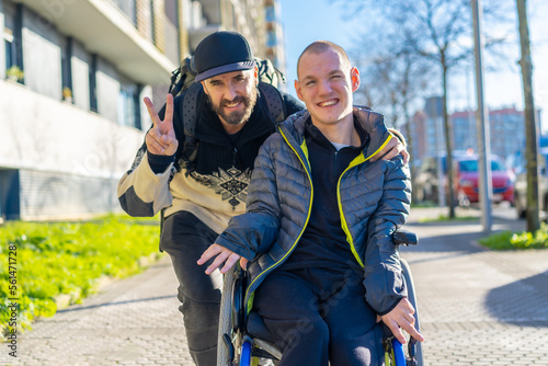 Tableau sur toile Portrait of a disabled person in a wheelchair with a friend, normality of disabl