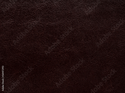 Luxury vintage genuine brown leather texture sample. Background with copy space. Leather pattern in dark tone. Faux eco leather. Backdrop textured effect for design, upholstered furniture, clothing.
