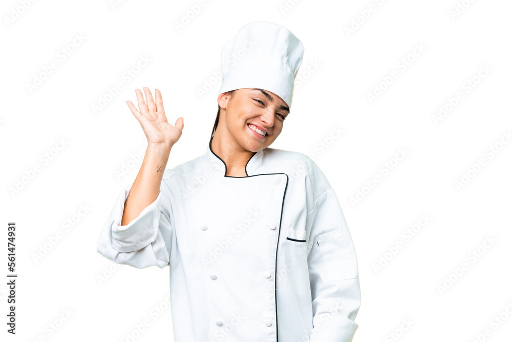 Young woman Chef over isolated chroma key background saluting with hand with happy expression Young woman Chef over isolated chroma key background saluting with hand with happy expression