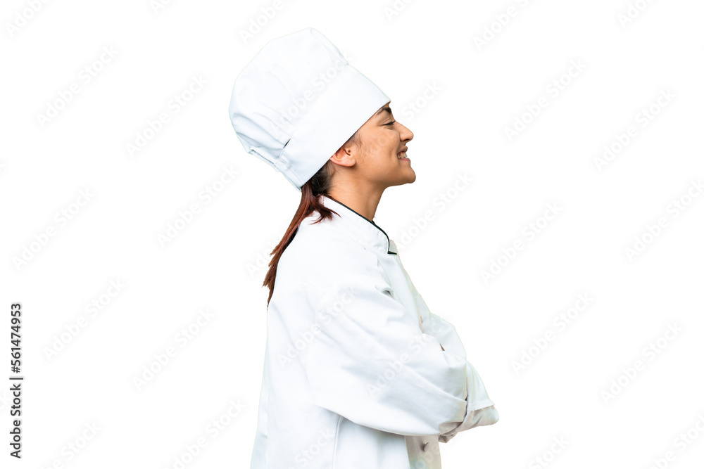 Young woman Chef over isolated chroma key background in lateral position