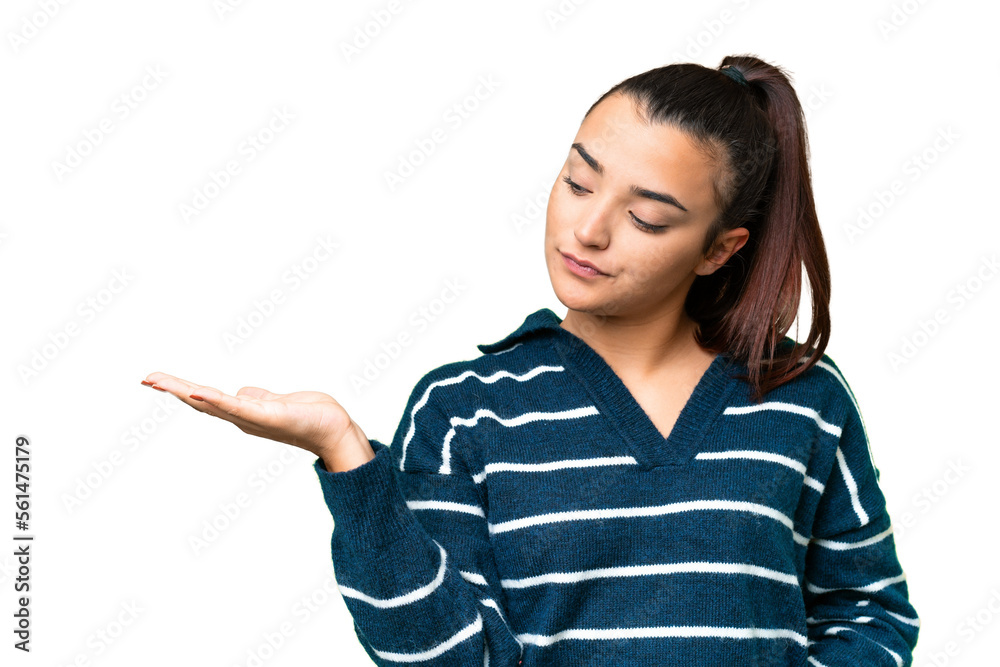 Young beauty woman over isolated chroma key background holding copyspace with doubts Young beauty woman over isolated chroma key background holding copyspace with doubts