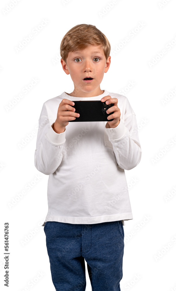 Surprised boy with smartphone in hands, isolated over white background Surprised boy with smartphone in hands, isolated over white background