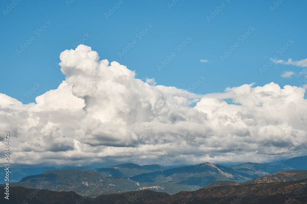Beautiful view of the mountain landscape in Antalya on the Aegean coast. Clouds over mountains after rain, background idea, travel and vacation story